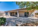 The backyard has a covered patio and low-maintenance gravel landscaping at 2253 Laurel Heights Ln, Henderson, NV 89052