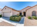 Inviting home exterior with a tidy front yard and a paved walkway to the front door at 2253 Laurel Heights Ln, Henderson, NV 89052