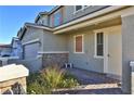 Inviting home facade showcasing stone accents, covered porch, and a charming entrance at 2832 Aragon Terrace Way, Henderson, NV 89044