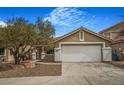 Charming home featuring desert landscaping, covered entry and a two-car garage at 3208 Paragon Pointe St, Las Vegas, NV 89129