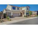 Beautiful two-story home with a three-car garage and tasteful landscaping at 3356 Dalmore St, Henderson, NV 89044