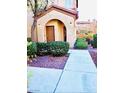 Charming condo entrance with tidy landscaping and an inviting front door at 3845 Wiggins Bay St # 104, Las Vegas, NV 89129