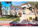 Beautifully landscaped townhouse with well-maintained lawn and charming facade at 502 Fragrant Orchard St, Henderson, NV 89015