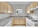 Efficient kitchen layout with essential appliances and a view from the window at 5650 E Sahara Ave # 1029, Las Vegas, NV 89142