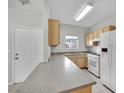 Functional kitchen featuring durable countertops and modern white appliances at 5650 E Sahara Ave # 1029, Las Vegas, NV 89142