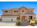 Charming two-story home featuring a three-car garage, well-maintained landscape, and a welcoming front porch at 6689 Sparks Ave, Las Vegas, NV 89142