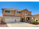 Beautiful two-story home with three-car garage, desert landscaping, and inviting front porch at 6689 Sparks Ave, Las Vegas, NV 89142