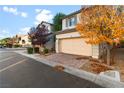 Inviting home with a two-car garage and a driveway with decorative pavers at 7253 Sterling Rock Ave, Las Vegas, NV 89178