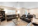 Comfortable living room featuring tile flooring and lots of seating at 7253 Sterling Rock Ave, Las Vegas, NV 89178