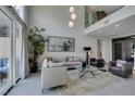 Bright, open living room with two-story ceilings and lots of natural light at 7999 Pinnacle Peak Ave, Las Vegas, NV 89113