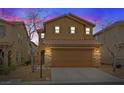 Beautiful two-story home with a tile roof and two-car garage is captured at sunset at 8683 Bella Jewel Ave, Las Vegas, NV 89178