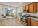 Bright eat-in kitchen with stainless steel appliances and a large window at 9489 Liquid Loco St, Las Vegas, NV 89178