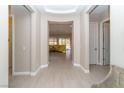 Bright entryway with neutral walls, tiled floor, and seamless transition to living spaces at 967 Buggy Whip Ct, Mesquite, NV 89034