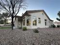 This home features a beautiful desert rock landscape and covered patio at 10301 Broom Hill Dr, Las Vegas, NV 89134