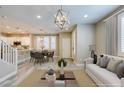 Bright living room features contemporary lighting, stylish furniture, and an open layout perfect for entertaining guests at 11396 Ogden Mills Dr # 101, Las Vegas, NV 89135