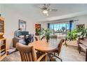 Bright dining area featuring a wood table set, large windows, wood floors, and ample natural light at 1831 Rosemere Ct, Las Vegas, NV 89117