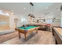Entertaining game room with a pool table, shuffleboard, stylish decor, and an open layout at 1831 Rosemere Ct, Las Vegas, NV 89117