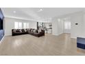 Bright and airy living room features wood floors and large windows at 2865 Victorian Rd, North Las Vegas, NV 89086