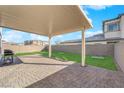 This is a covered patio with brick flooring, perfect for outdoor dining and relaxation at 2865 Victorian Rd, North Las Vegas, NV 89086