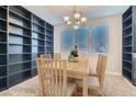 Bright dining room features large windows and built-in shelving for ample storage and display at 336 S Milan St, Henderson, NV 89015