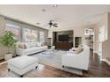 Spacious living room boasts hardwood floors, recessed lighting, and large windows at 336 S Milan St, Henderson, NV 89015