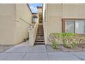 Exterior shot of building highlighting the front entrance and staircase at 3672 Angela Robin St # 206, Las Vegas, NV 89129