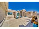 Relaxing courtyard featuring a pair of Adirondack chairs and potted desert plants at 5090 Balhurst Ct, Pahrump, NV 89061