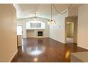 Spacious living room featuring hardwood floors, a fireplace, and neutral walls at 629 Bright Lights Ave, North Las Vegas, NV 89031