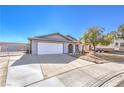 Single-story home with a two-car garage and extended driveway, offering ample parking and curb appeal at 6741 Bonillo Dr, Las Vegas, NV 89103