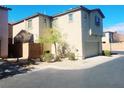 Two-story home featuring a stucco exterior, attached garage, and low maintenance desert landscaping at 8957 Rufina St, Las Vegas, NV 89148
