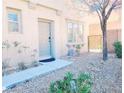 Charming front entrance with a stone pathway, xeriscaping, and inviting front door at 8957 Rufina St, Las Vegas, NV 89148