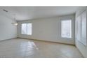 Bright living room with tile flooring, neutral walls, and ample natural light at 9378 Spellman Ct, Las Vegas, NV 89123