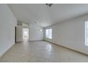 Bright living room with tile flooring, neutral walls, and ample natural light at 9378 Spellman Ct, Las Vegas, NV 89123