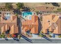 An aerial view of a home with an orange tile roof, swimming pool, and desert landscaping at 2265 Lauren Dr, Las Vegas, NV 89134