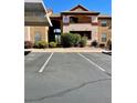 Inviting condo complex with well-maintained landscaping, numbered parking spots, and a covered entry way at 231 W Horizon Ridge Pkwy # 514, Henderson, NV 89012