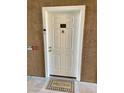 A welcoming white front door adorned with unit number and a charming 'Welcome' mat at 231 W Horizon Ridge Pkwy # 514, Henderson, NV 89012