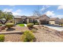 Inviting single-Gathering home with well-maintained desert landscaping and a charming front entrance at 2921 Hayden Creek Ter, Henderson, NV 89052