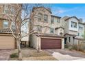 Charming two-story home with a brick driveway and two-car garage at 382 Gracious Way, Henderson, NV 89011