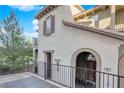 Attractive townhome with a private entrance, wrought iron fencing, and a tile roof at 41 Via Verso Lago, Henderson, NV 89011