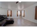 Bright living room with tile floors and natural light coming in from multiple windows at 5541 Ramirez St, North Las Vegas, NV 89031