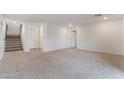 Spacious living room with neutral carpet, recessed lighting, and white walls at 5745 Becklow Gardens Ave, Las Vegas, NV 89141