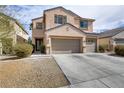 Two-story home with a three car garage, desert landscaping, and neutral paint at 6938 Silk Oak Ct, Las Vegas, NV 89148