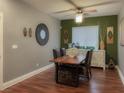 Dining room featuring hardwood floors, a modern table, and stylish decor at 8558 Rumsfield Ct, Las Vegas, NV 89131