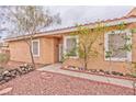 Inviting front entrance with desert landscaping and a well-maintained walkway at 9002 Purple Leaf St, Las Vegas, NV 89123