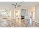 Spacious living room with hardwood floors and a modern fireplace at 9002 Purple Leaf St, Las Vegas, NV 89123