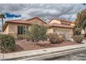 Inviting single-story home with a mature front yard and two-car garage at 9071 Ravenhurst St, Las Vegas, NV 89123