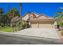 Lovely single-story house with a spacious driveway and manicured front yard at 9725 La Cienega St, Las Vegas, NV 89183