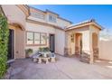 Inviting back patio featuring a custom tiled table and serene outdoor space at 11773 Golden Moments Ave, Las Vegas, NV 89138