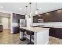 Beautiful kitchen featuring granite countertops, stainless steel appliances, and custom cabinetry at 1033 Via Dell Bacio Dr, Henderson, NV 89052