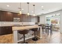 Modern kitchen featuring a spacious island, stainless steel appliances, and ample cabinet space at 1033 Via Dell Bacio Dr, Henderson, NV 89052